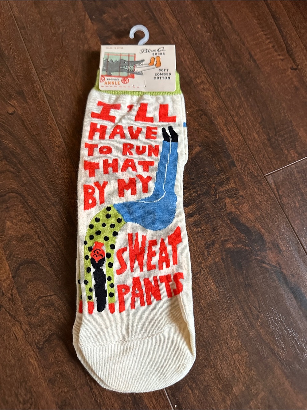 Blue Q Cream Crew Socks with Red Text and Blue & Green Graphic